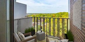 East Cleveland apartment for rent - a balcony with a view of the city and trees