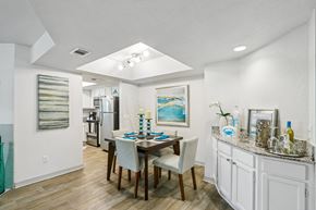 Ponte Vedra Beach apartment for rent - A dining room with a table set for two and a painting on the wall.