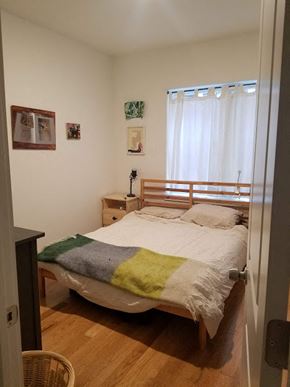 Philadelphia apartment for rent - a bedroom with a bed with a blanket on it
