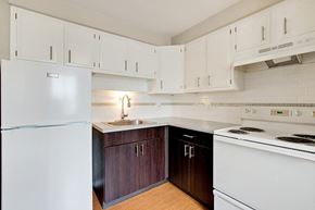 Denver apartment for rent - a kitchen with white appliances and white cabinets