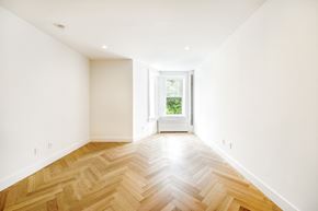 Brooklyn apartment for rent - a living room with a hard wood floor and a window