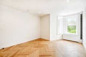 Brooklyn apartment for rent - an empty room with wood flooring and a window