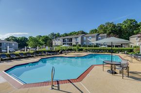 Lexington Park apartment for rent - our apartments have a resort style pool with chairs and tables