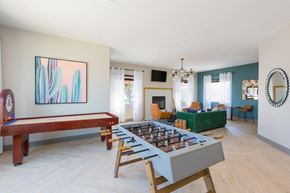Phoenix apartment for rent - A room with a pool table and a couch.