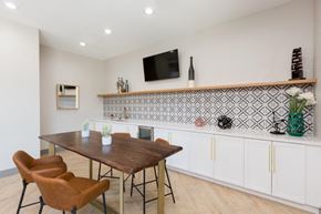 Phoenix apartment for rent - A dining room with a wooden table and chairs.
