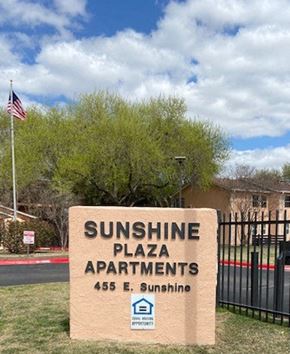 San Antonio apartment for rent - a sunshine plaza apartments sign in front of a gate