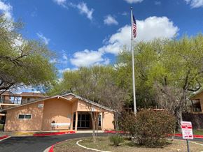 San Antonio apartment for rent - a building with an flag in front of it