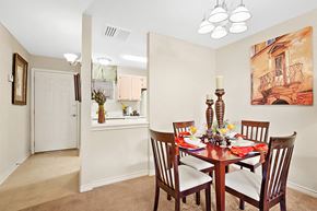 Metairie apartment for rent - A dining room with a table set for four.