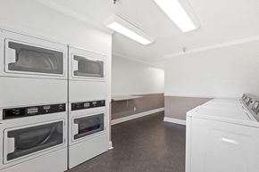 Metairie apartment for rent - a white kitchen with white appliances and white counters