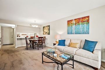 Metairie apartment for rent - A living room with a white couch and a coffee table.