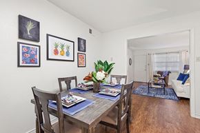 Metairie apartment for rent - A dining room with a table set for a meal.