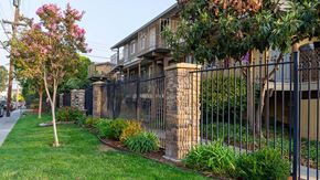Livermore apartment for rent - Landscape view by fence  l Alderwood Park Apartments in Livermore CA 