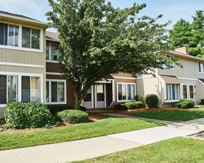 Indianapolis apartment for rent - a sidewalk in front of a row of houses