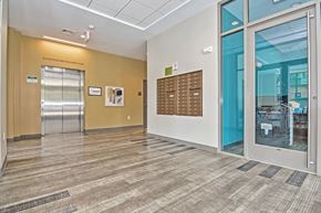 Boston apartment for rent - the lobby of a building with glass doors and a vending machine