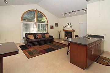 Howell apartment for rent - a living room with a couch and a kitchen with a sink