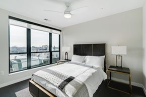 Edina apartment for rent - a bedroom with a large bed and a large window