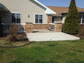 Delavan apartment for rent - a concrete patio in front of a house