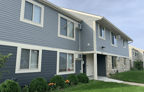 Stoughton apartment for rent - a blue house with gray siding and a white door