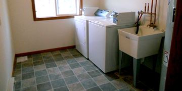 Dodgeville apartment for rent - the laundry room has a washer and dryer and a sink