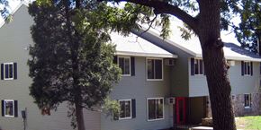 Dodgeville apartment for rent - a white house with a tree in front of it