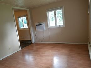 El Paso apartment for rent - an empty living room with wooden floors and a window