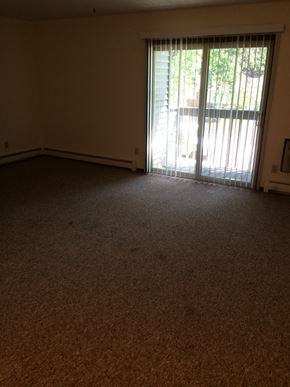 Lodi apartment for rent - A room with a carpet floor and a sliding glass door.
