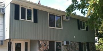 Darlington apartment for rent - the exterior of a house with green siding and windows