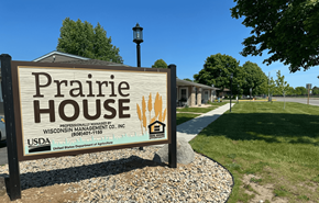 Sauk City apartment for rent - a sign that reads prairie house in front of a building