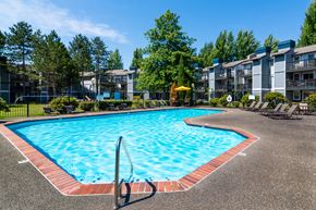 Bothell apartment for rent - a swimming pool in front of an apartment building