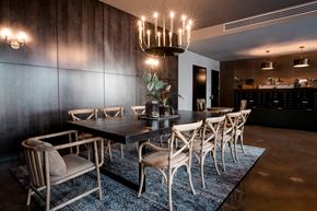 Chicago apartment for rent - a dining room with a long table and chairs and a chandelier