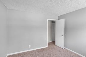 Indianapolis apartment for rent - an empty bedroom with a door to a closet
