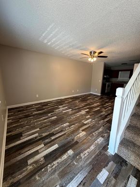 Calhoun apartment for rent - A room with a wooden floor and a ceiling fan.