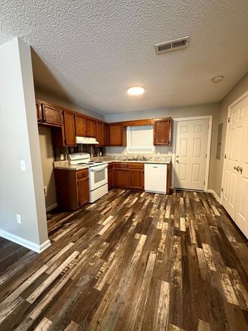 Calhoun apartment for rent - A kitchen with white appliances and wooden floors.
