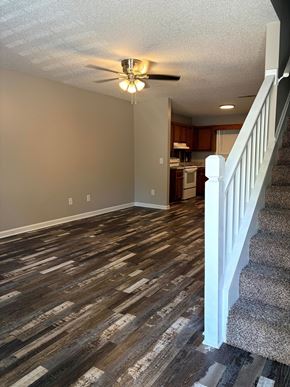 Calhoun apartment for rent - A room with a staircase and a ceiling fan.