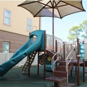 Houma apartment for rent - a playground with a slide and a umbrella