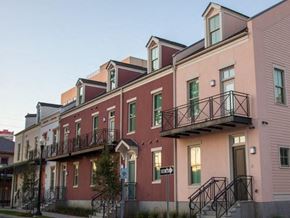 New Orleans apartment for rent - a row of buildings with balconies on them