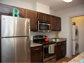 New Orleans apartment for rent - a kitchen with stainless steel appliances and a refrigerator