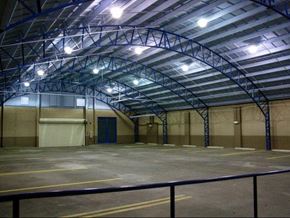 New Orleans apartment for rent - an empty parking lot with a blue door