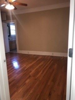 Calhoun house for rent - an empty living room with a wooden floor