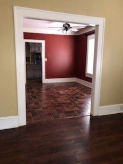 Calhoun house for rent - a living room with a wood floor and a ceiling fan
