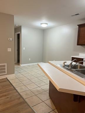 Calhoun apartment for rent - an empty kitchen and living room with a sink and a counter