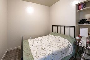Boise apartment for rent - a small bedroom with a bed and a closet