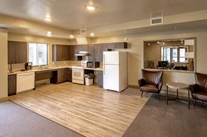 Boise apartment for rent - a kitchen and living room with a refrigerator and a sink