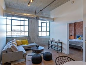 Windsor Locks apartment for rent - Living Room with Exposed Concrete Walls at Montgomery Mill Apartments in Windsor Locks, CT