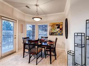Aurora apartment for rent - A dining room with a table set for six.