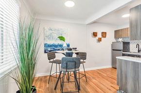 Denver apartment for rent - a dining room with a table and chairs and a kitchen