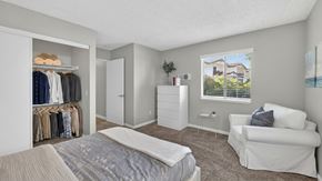 San Marcos apartment for rent - A bedroom with a bed, a couch, and a wardrobe.