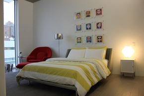 Cleveland apartment for rent - a bedroom with a bed and a chair and a window