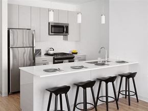 Chicago apartment for rent - a kitchen with a counter and three bar stools