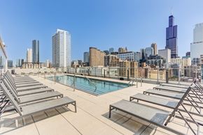 Chicago apartment for rent - the pool on the rooftop of a building with the city in the background